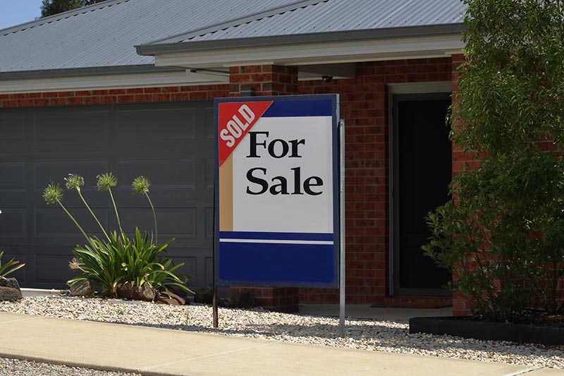 House with for sale sign